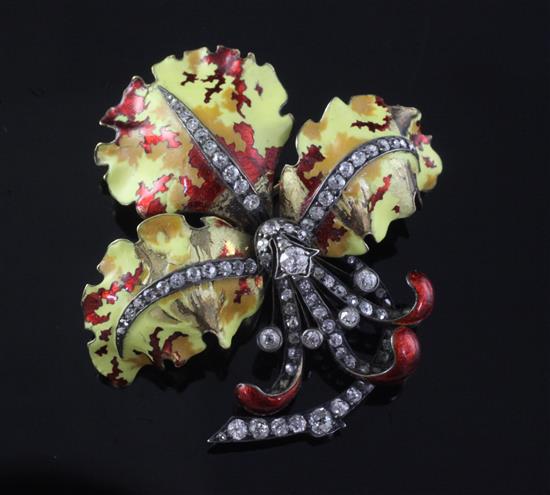 An Edwardian gold and silver, polychrome enamel and diamond set orchid brooch, 48mm.